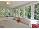 Bright sunroom with lots of windows, storage drawers, and natural light at 110 Heatherwood Dr, Fayetteville, GA 30215