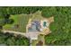 Tranquil property with a beautiful pool area and mature trees providing shade and privacy at 140 Olivia Ct, Fayetteville, GA 30215