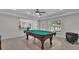 Finished basement with a billiard table and an electric fireplace at 140 Olivia Ct, Fayetteville, GA 30215