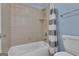 Bathroom with a white shower-tub combination and tiled wall surround at 140 Olivia Ct, Fayetteville, GA 30215
