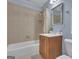 Bathroom featuring a tub-shower, wood vanity and blue-painted walls at 140 Olivia Ct, Fayetteville, GA 30215