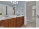 Bathroom featuring a double vanity, large mirror and view into another room at 140 Olivia Ct, Fayetteville, GA 30215