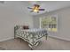 Bedroom with a window view of the backyard and a ceiling fan at 140 Olivia Ct, Fayetteville, GA 30215