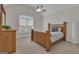 Bedroom with light-filled window, ceiling fan, and vaulted ceilings at 140 Olivia Ct, Fayetteville, GA 30215