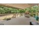 View of the deck with stainless steel grill, seating, and wooded backyard at 140 Olivia Ct, Fayetteville, GA 30215
