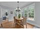 Dining area with chandelier, hardwood floors, and large windows at 140 Olivia Ct, Fayetteville, GA 30215