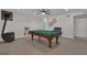 This game room features a pool table, a fireplace, and neutral-colored walls with tile floors at 140 Olivia Ct, Fayetteville, GA 30215