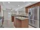 A kitchen featuring stainless steel appliances and a center island with granite countertops at 140 Olivia Ct, Fayetteville, GA 30215
