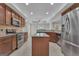 A kitchen featuring stainless steel appliances and a center island with granite countertops at 140 Olivia Ct, Fayetteville, GA 30215
