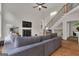 Spacious living room with a cozy fireplace, hardwood floors, and staircase at 140 Olivia Ct, Fayetteville, GA 30215
