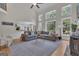 Open-concept living room with floor-to-ceiling windows at 140 Olivia Ct, Fayetteville, GA 30215