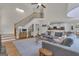 Bright living room with open floor plan, hardwood floors, plush seating, and modern staircase at 140 Olivia Ct, Fayetteville, GA 30215