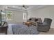 A living room featuring a sofa, a recliner, and a patterned rug at 140 Olivia Ct, Fayetteville, GA 30215