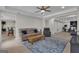 A living room with modern furniture, tile floors, and access to other areas of the home at 140 Olivia Ct, Fayetteville, GA 30215