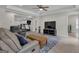 A living room with tile flooring, modern furniture, and an exercise area at 140 Olivia Ct, Fayetteville, GA 30215