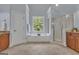 Bathroom with a soaking tub, separate shower, dual vanities, and natural light at 140 Olivia Ct, Fayetteville, GA 30215