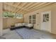 Covered outdoor patio space with seating, rug, and access to the yard at 140 Olivia Ct, Fayetteville, GA 30215