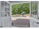 Inviting backyard pool area as seen from inside with well-manicured landscaping at 140 Olivia Ct, Fayetteville, GA 30215