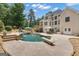 Backyard with in-ground pool, diving board, waterfall feature, and ample seating at 140 Olivia Ct, Fayetteville, GA 30215