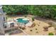Beautifully landscaped pool area featuring a deck, seating, and a well-maintained garden at 140 Olivia Ct, Fayetteville, GA 30215