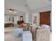 Inviting sitting area with plush armchairs, ottomans, and views into the main bedroom at 140 Olivia Ct, Fayetteville, GA 30215