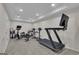 A bright workout room with an elliptical, treadmill, and weight rack at 140 Olivia Ct, Fayetteville, GA 30215
