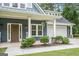 Charming home with a well-manicured lawn, inviting entryway, and attached two-car garage at 9148 Tarnwood Dr, Villa Rica, GA 30180
