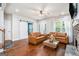 Bright living room with hardwood floors, stylish furniture, and large windows at 9148 Tarnwood Dr, Villa Rica, GA 30180