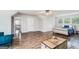 Spacious living space featuring stylish seating and hardwood floors at 9148 Tarnwood Dr, Villa Rica, GA 30180