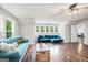 Bright living space featuring stylish seating and hardwood floors at 9148 Tarnwood Dr, Villa Rica, GA 30180