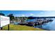 Picturesque waterfront marina with docked boats next to a restaurant under a sunny sky at 9148 Tarnwood Dr, Villa Rica, GA 30180