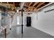 Basement with water heater, refrigerator and walkout to the backyard, perfect for storage or future expansion at 3797 Churchill Sw Dr, Marietta, GA 30064