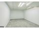 Finished basement space with white walls and tile flooring ready for customization at 3797 Churchill Sw Dr, Marietta, GA 30064