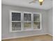 Sunlit bedroom with large windows showcasing outdoor views and offering a bright, inviting space at 3797 Churchill Sw Dr, Marietta, GA 30064