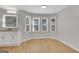 Cozy breakfast nook featuring wood-look flooring, white cabinetry and a bay window overlooking the yard at 3797 Churchill Sw Dr, Marietta, GA 30064