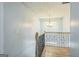 A carpeted staircase with chandelier, wooden handrail, and decorative railing at 3797 Churchill Sw Dr, Marietta, GA 30064