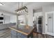 Kitchen with island features stainless refrigerator, and pantry at 6448 Mobilis Ct, Sugar Hill, GA 30518