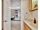 Bathroom featuring a wooden vanity with a sink, mirror, and storage cabinets at 676 Mcbride Rd, Fayetteville, GA 30215