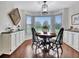 Bright breakfast nook with wood flooring, bay window, and decorative chandelier at 676 Mcbride Rd, Fayetteville, GA 30215