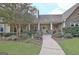 Inviting front entrance with a well-manicured lawn and stone walkway leading to a welcoming porch at 676 Mcbride Rd, Fayetteville, GA 30215