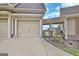 Attached three-car garage with tan doors and manicured landscaping at 676 Mcbride Rd, Fayetteville, GA 30215