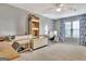 Home office featuring a carpeted floor, a ceiling fan, desk space and large windows at 676 Mcbride Rd, Fayetteville, GA 30215