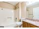 Well-lit bathroom with a combination tub and shower, complemented by a vanity sink at 1099 Westfield Se Trce, Smyrna, GA 30082