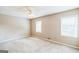 Bright carpeted bedroom with a ceiling fan and well-lit by two windows at 1099 Westfield Se Trce, Smyrna, GA 30082