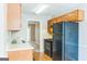 Functional kitchen equipped with wood cabinets and essential appliances at 1099 Westfield Se Trce, Smyrna, GA 30082
