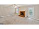 Spacious living room featuring a classic brick fireplace and access to the outdoors at 1099 Westfield Se Trce, Smyrna, GA 30082