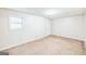 Bright, spacious living room boasts fresh carpeting, lots of natural light, and a neutral color scheme at 1099 Westfield Se Trce, Smyrna, GA 30082