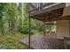 Shaded patio with lush greenery, perfect for outdoor dining and enjoying the surrounding nature at 1099 Westfield Se Trce, Smyrna, GA 30082