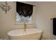 Bathroom featuring a free-standing tub with black out shade at 2587 Alvecot Cir, Atlanta, GA 30339