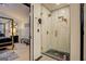 Bathroom featuring a glass shower with gold hardware and modern tile at 2587 Alvecot Cir, Atlanta, GA 30339